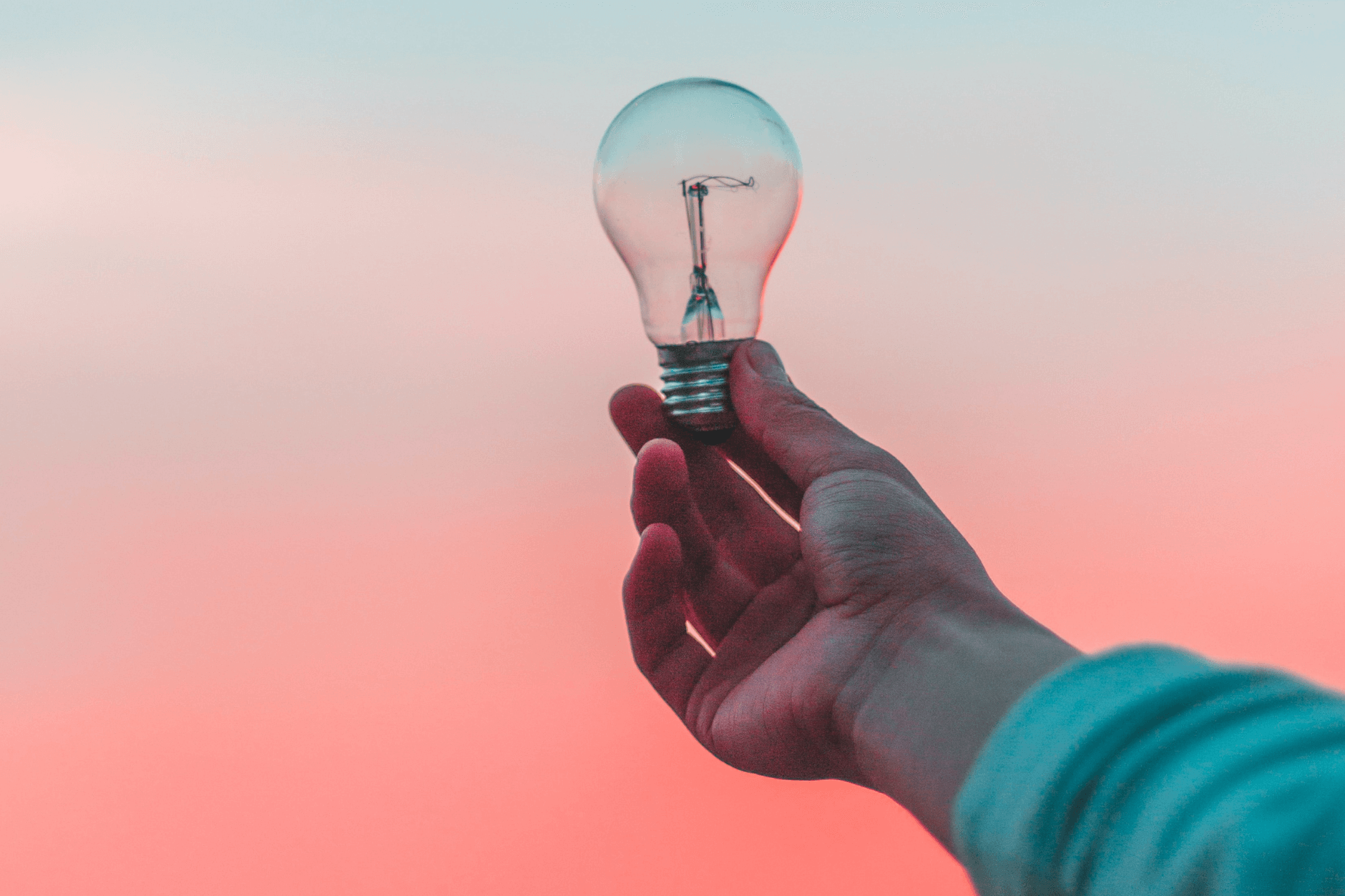 hand holding a light bulb