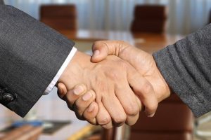 two businessmen shaking hands