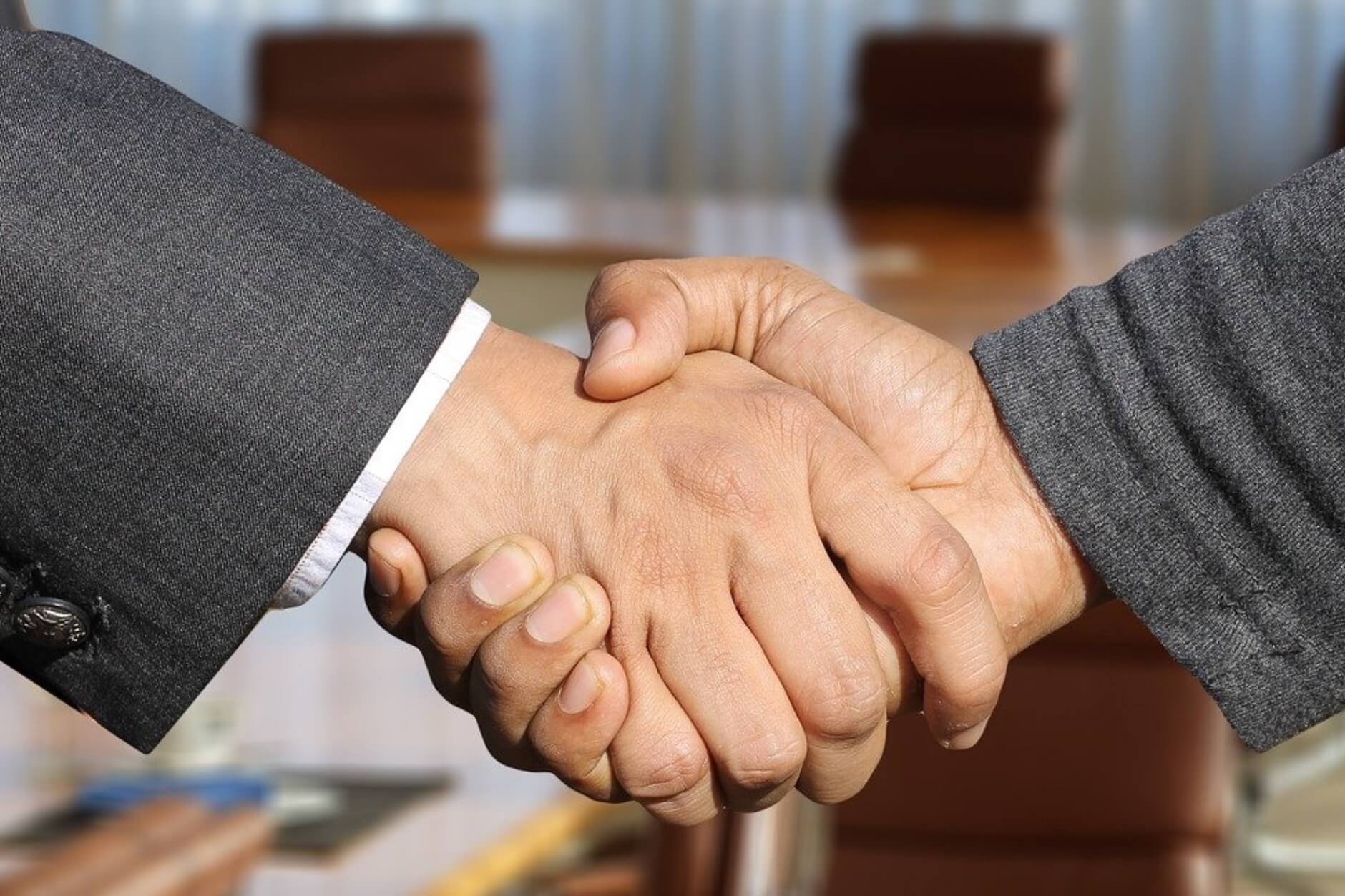 two businessmen shaking hands