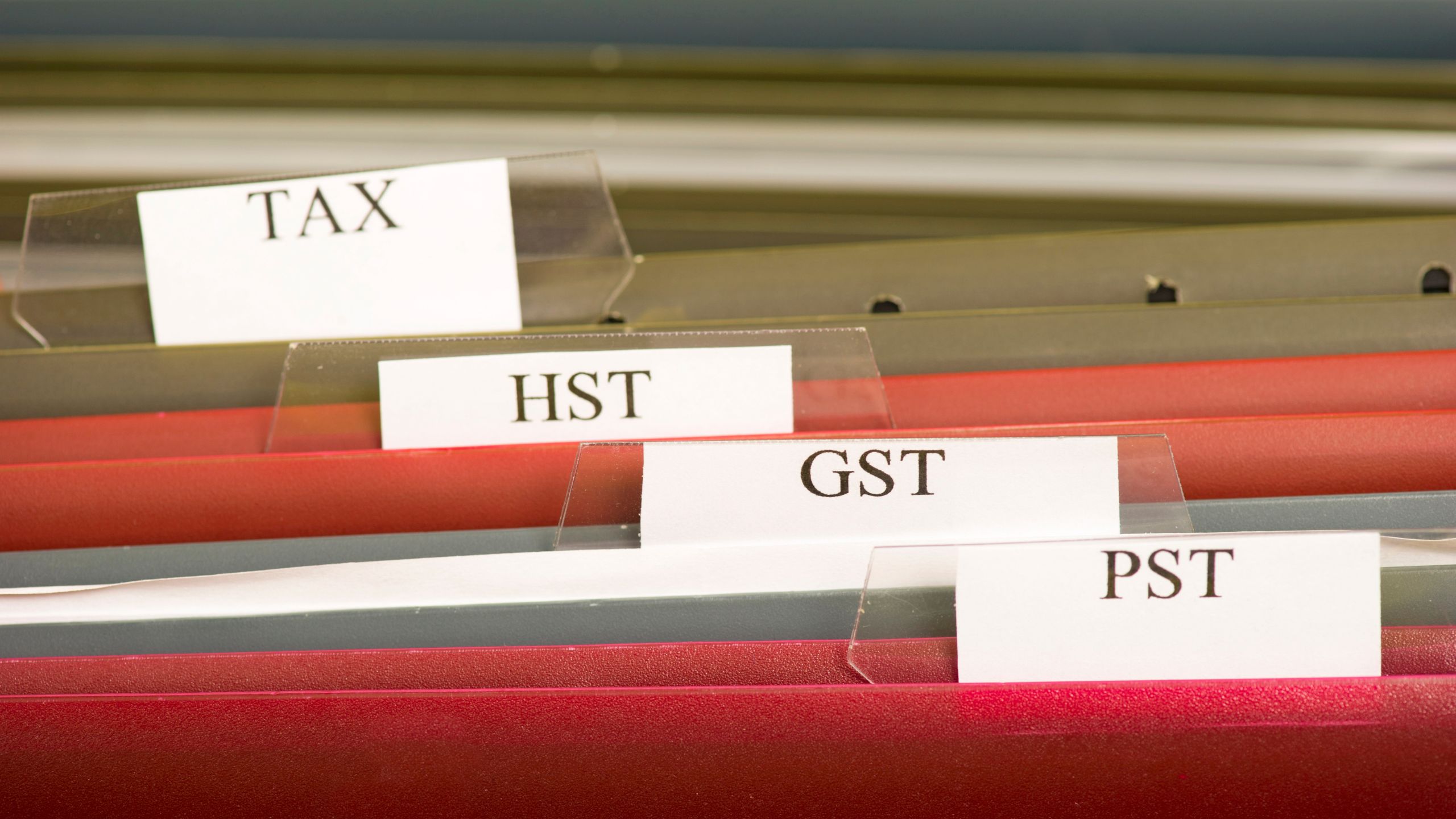 A filing cabinet to help a small business owner stay on top of their HST/GST filing – Merchant Growth