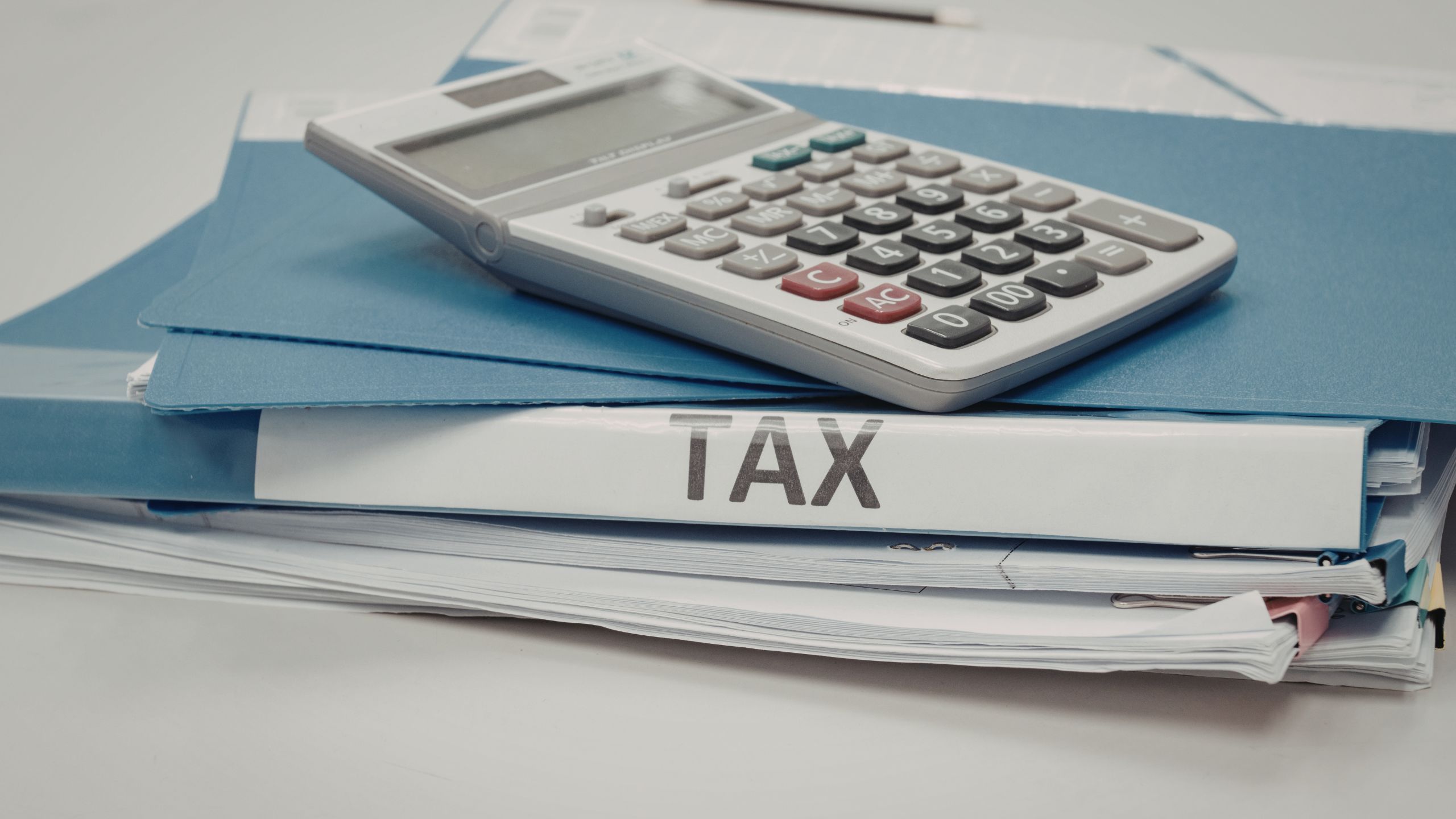 A tax binder full of forms and documents ready for small business tax filing