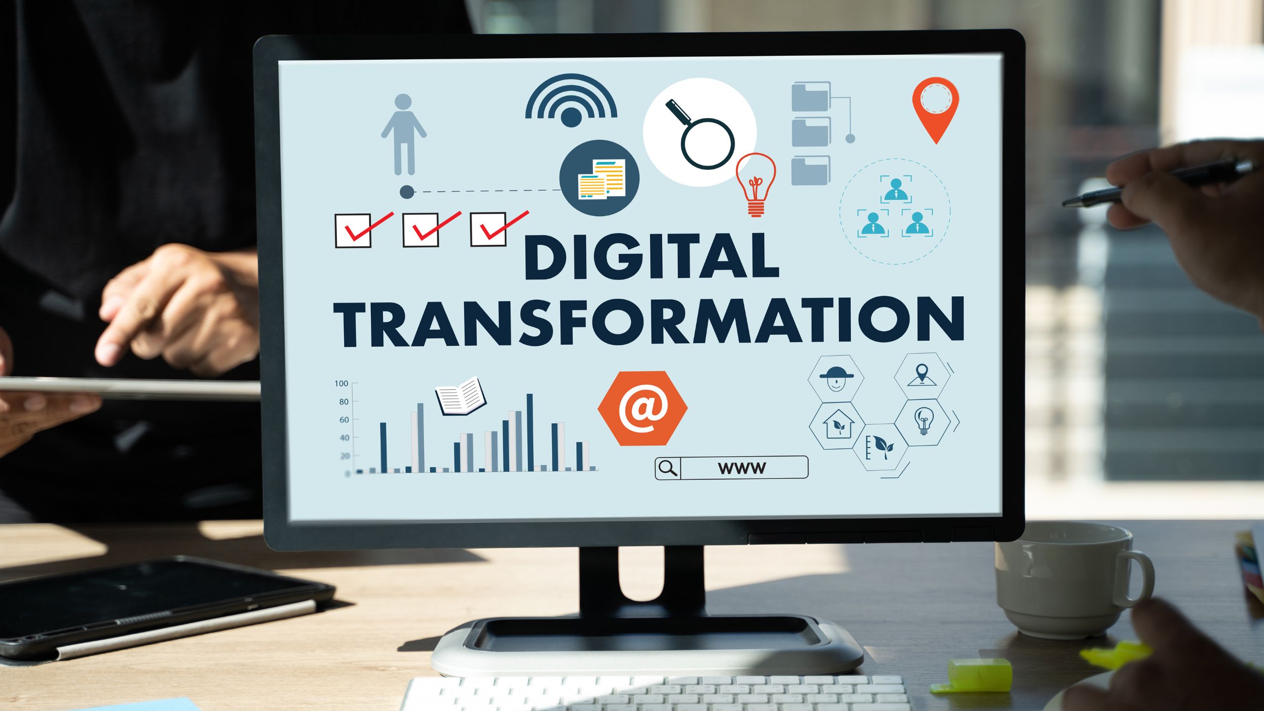 A graphic of a laptop showing all the elements of digital transformation
